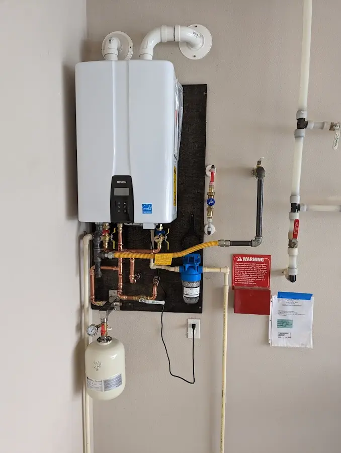 Professional plumber installing copper piping in a Mercer Island home